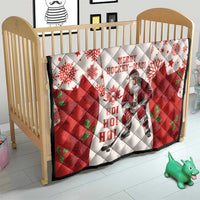 Christmas hockey quilt on a wooden crib: red and white with maple leaves and Santa graphic
