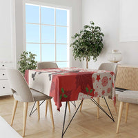 Red and white hockey tablecloth with “Merry Hockey-Mas” banner and maple leaf motifs