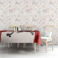 Red and white hockey tablecloth featuring Santa and maple leaves on a dining table
