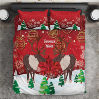 Red Christmas bedding set with caribou, maple leaf, and Joyeux Noel print