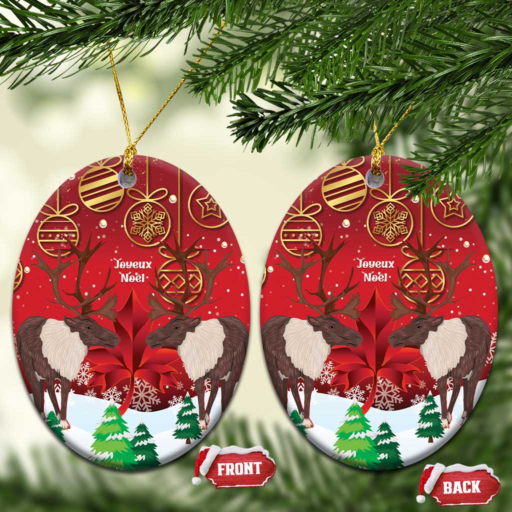 Pair of red ceramic oval ornaments with caribou scene, gold hanging loops