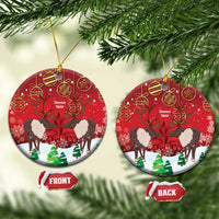 Red ceramic Christmas ornament with caribou scene, round shape, gold hanging loop, front/back tags