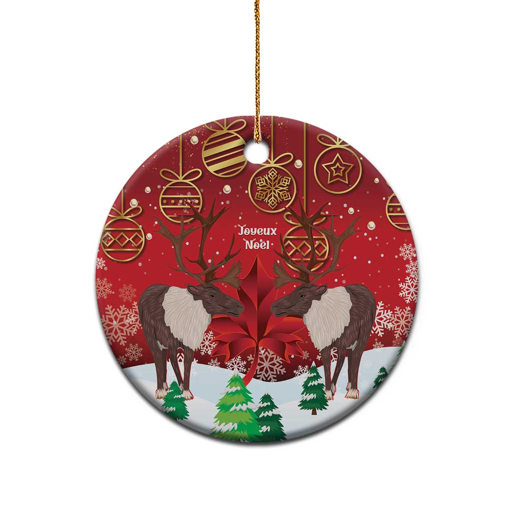 Red round ceramic Christmas ornament with caribou scene, gold hanging string loop