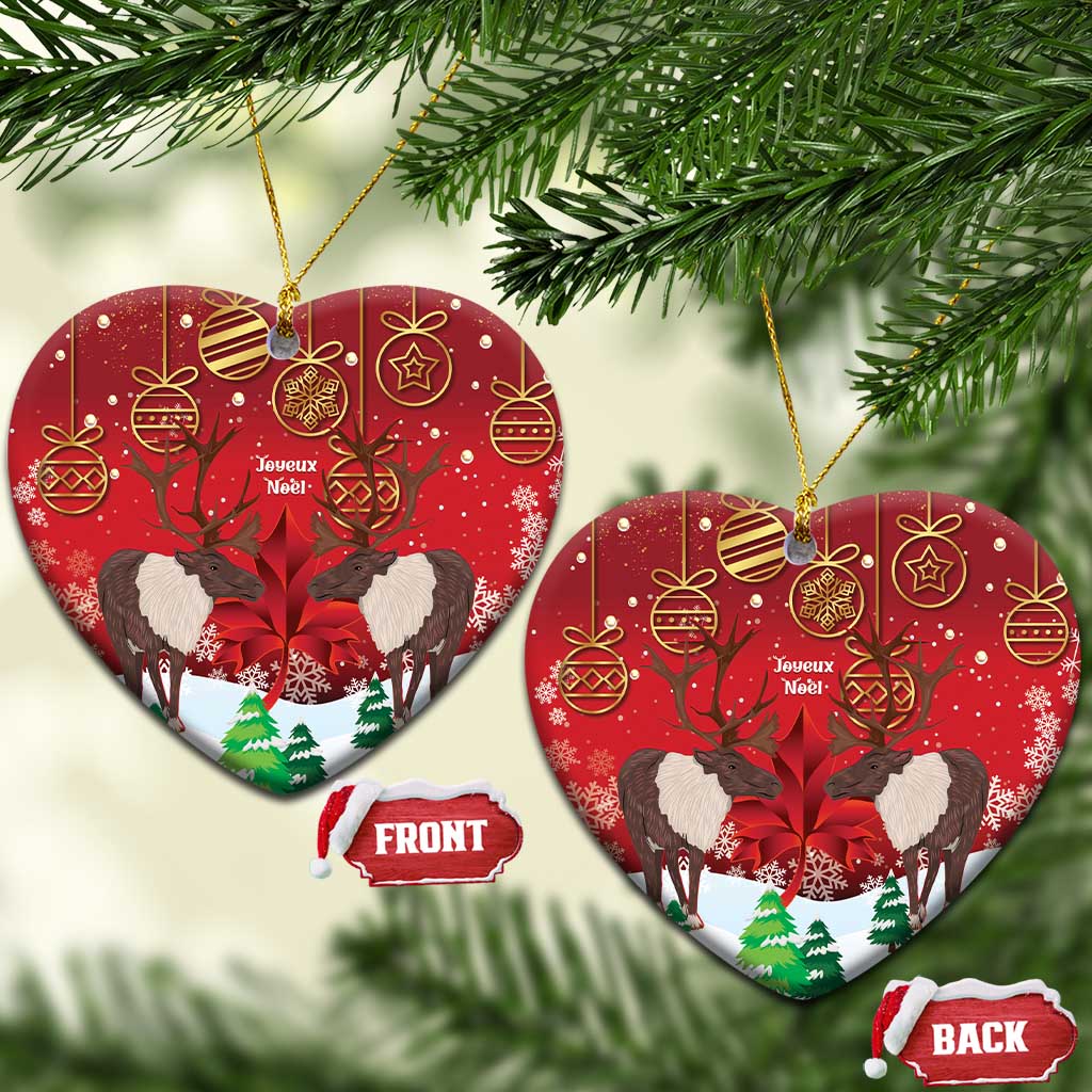 Red ceramic heart ornament with caribou scene, gold hanging loop, front and back labels