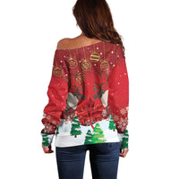 Red off-shoulder sweater with reindeer-and-holiday ornaments graphic on back, long sleeves