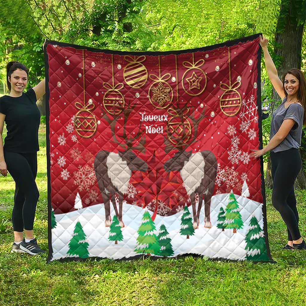 Red Christmas quilt, caribou silhouette, 'Joyeux Noel' text, and green tree border