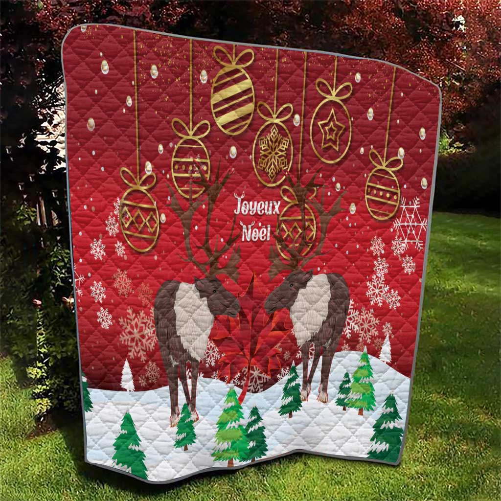 Red Christmas quilt blanket with caribou silhouettes, gold baubles, and 'Joyeux Noel' text