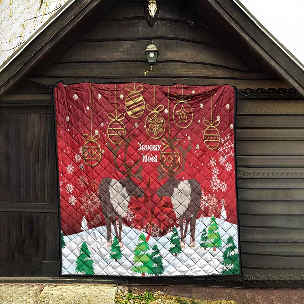 Red Christmas quilt hanging on barn door, caribou silhouettes, 'Joyeux Noel' and baubles