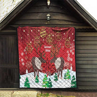 Red Christmas quilt hanging on barn door, caribou silhouettes, 'Joyeux Noel' and baubles