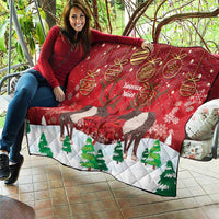 Red Christmas quilt on patio seating, caribou hearts, 'Joyeux Noel' text, and trees