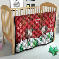 Red Christmas quilt on baby crib, caribou silhouettes, 'Joyeux Noel' and green tree prints