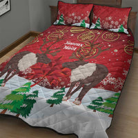 Red quilt bed set featuring caribou, green fir trees, and snowflake patterns with pillows