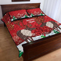 Red quilt bed set with caribou print, snowflakes, and green fir trees with matching pillows