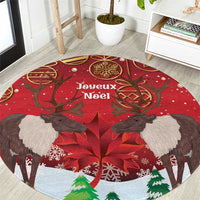 Red round Christmas rug with reindeer, poinsettia, and “Joyeux Noel” center text