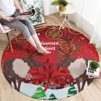 Red circular Christmas rug with four reindeer faces, tree prints, and Joyeux Noel