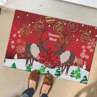 Red Christmas doormat with caribou, 'Joyeux Noel' text, snowflakes and ribbon ornament icons