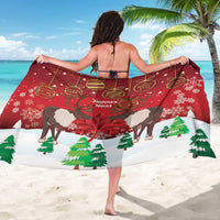 Red Christmas sarong with caribou, maple leaf, ornaments, and pine trees