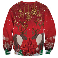 Red crewneck Christmas sweatshirt with caribou graphic and hanging ornament pattern