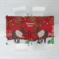 Red Christmas tablecloth with caribou, maple leaf, and Joyeux Noel print