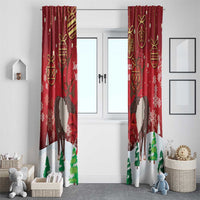 Red Christmas window curtain panels with reindeer, gold baubles, and green pine tree border.