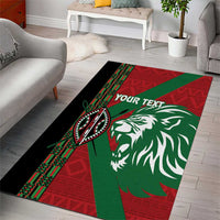 Long red and green lion head area rug with black stripe and patterned trim