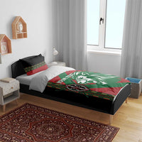 Red and green lion bedding set on bed with black accents, includes duvet and two shams