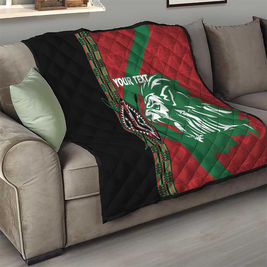 Red and green quilt with white lion face graphic, black quilted panel, decorative side trim