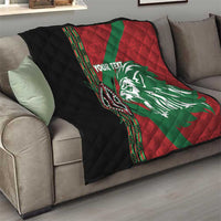 Red and green quilt with white lion face graphic, black quilted panel, decorative side trim
