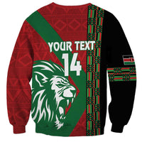 Red and black unisex sweatshirt with green lion face, 'YOUR TEXT' and number 14