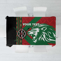 Red and green custom tablecloth with lion head graphic and African pattern panel