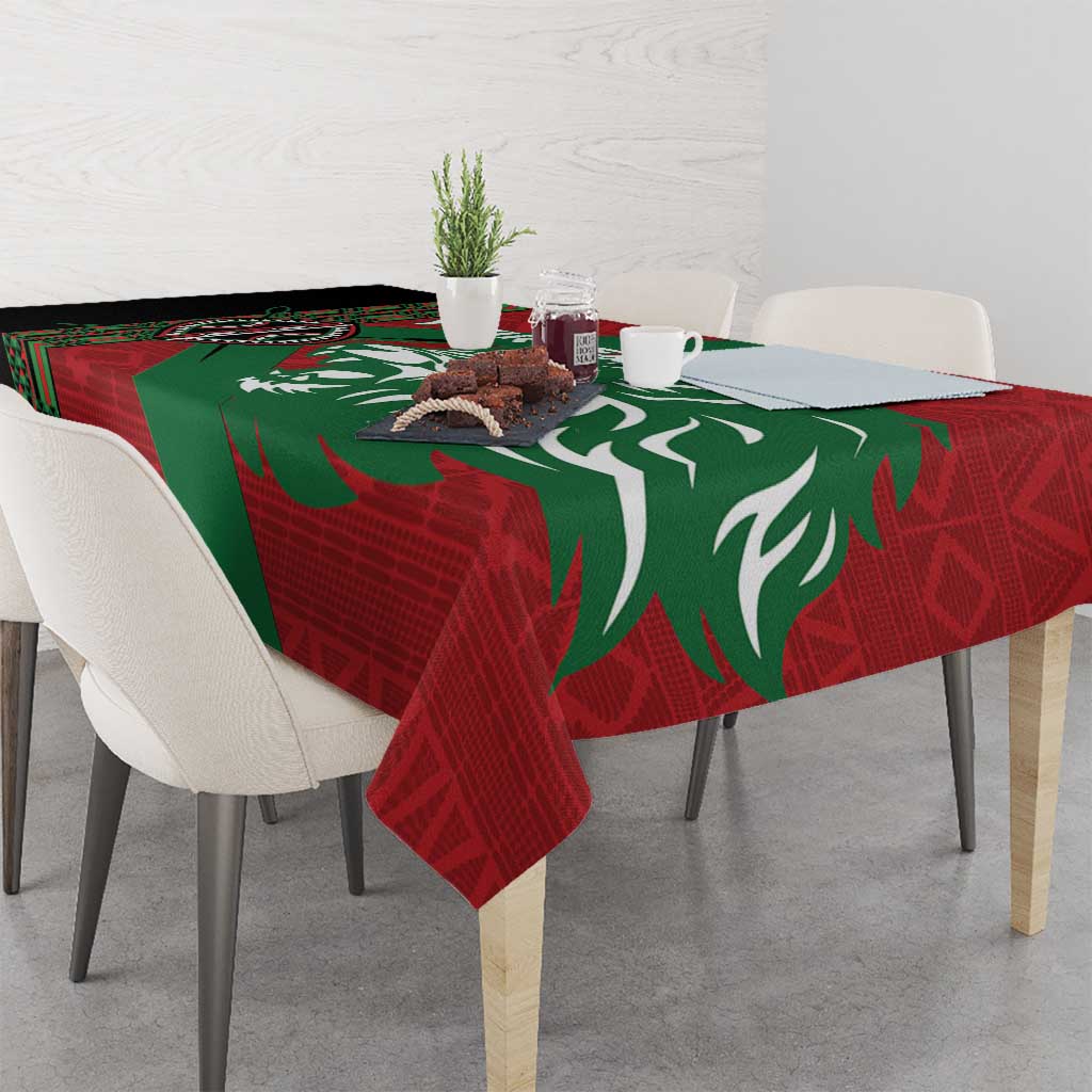 Red and green patterned tablecloth with large lion silhouette on dining table
