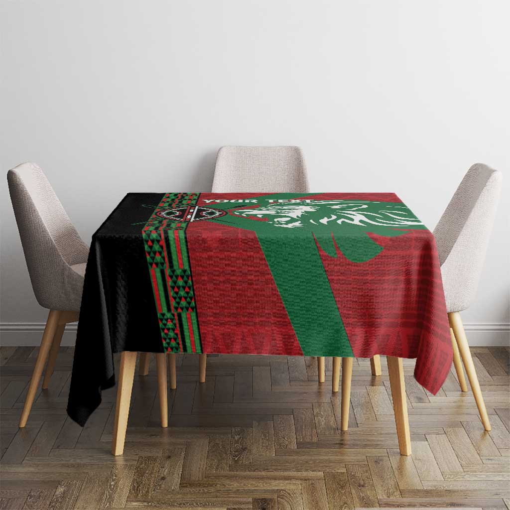 Red and green African pattern tablecloth with central lion graphic on square dining table