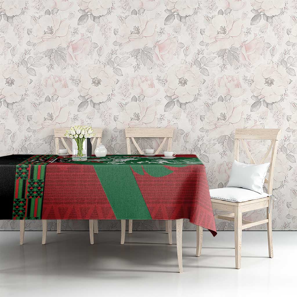 Red and green lion and geometric pattern tablecloth on long dining table with chairs