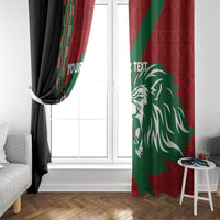 Kenya rugby window curtains, red green lion artwork and black panel framing a window