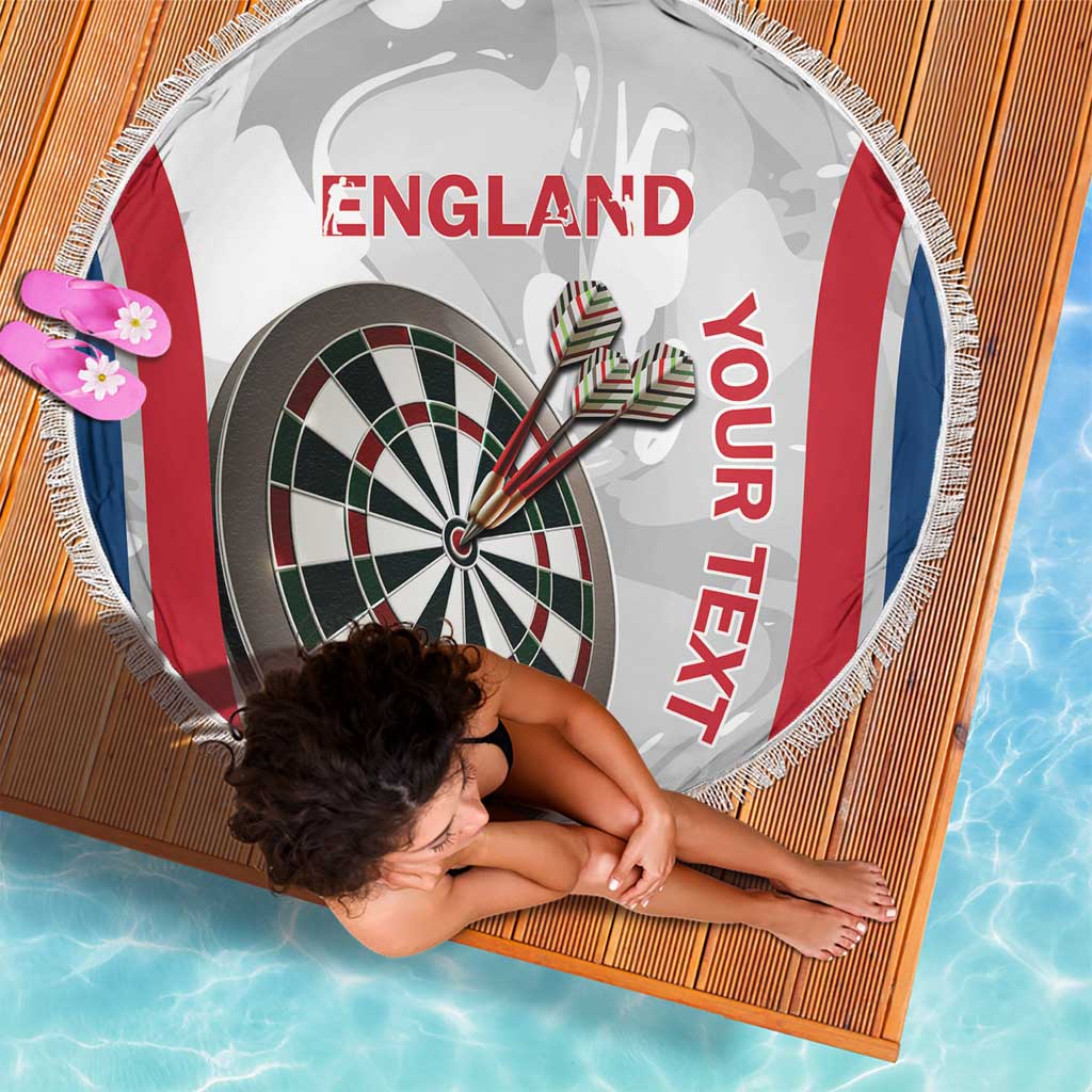 Round beach blanket with fringe showing England dartboard graphic with red and blue sides
