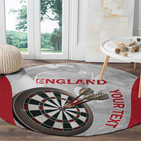 Round darts carpet showing England lettering and dartboard on gray marble-style fabric