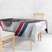 England darts tablecloth laid on bench with dartboard and red, white, blue stripe print