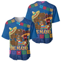 Set of two blue baseball jerseys with colorful 'De Mayo' graphics, short sleeves, buttons