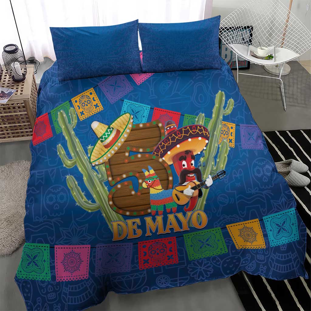 Blue bedding set with two pillows, 'DE MAYO' graphic with cacti and sombrero musicians