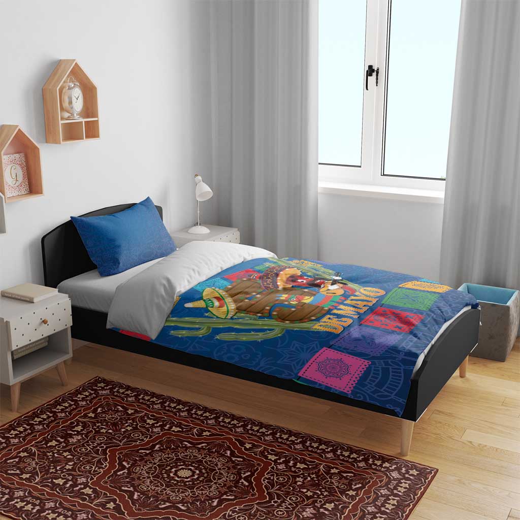 Blue bedding set with two pillows, 'DE MAYO' blanket design, colorful festival squares
