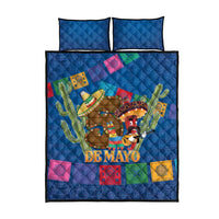 Blue quilt bed set with two pillows and 'DE MAYO' cowboy artwork with cactus
