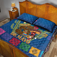 Blue quilt bed set with 'DE MAYO' print, cactus and colorful squares, on bed
