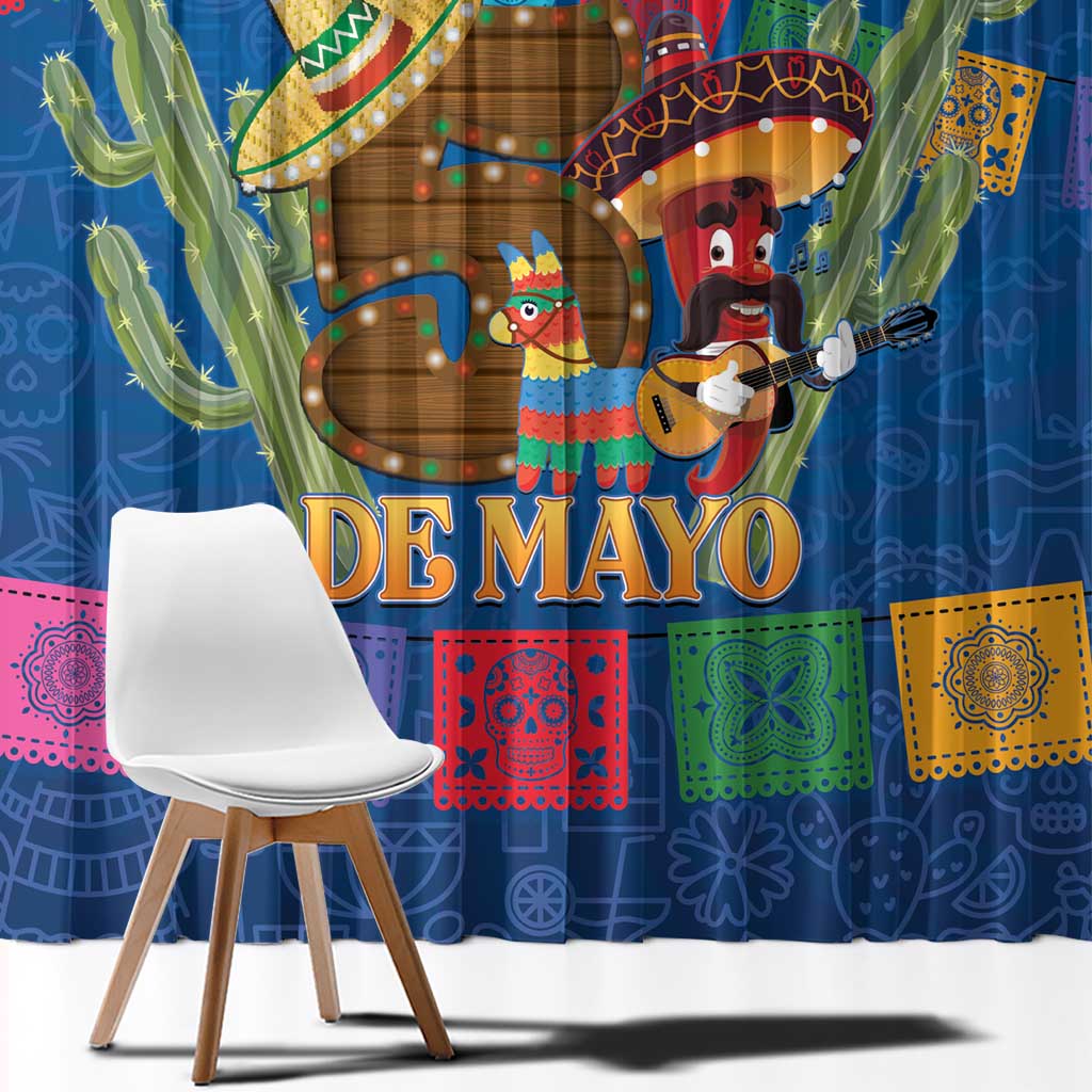 Close-up of blue window curtain showing “DE MAYO” text, cactus, and guitar player.