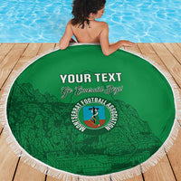 Round green beach blanket with white fringe, 'YOUR TEXT' and 'Go Emerald Boys' lettering.