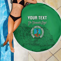 Green round beach blanket with white fringe, 'YOUR TEXT' and football association logo.
