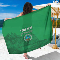 Emerald green sarong with custom text and football crest print, wide draped wrap
