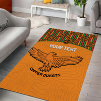Orange rectangular area rug with Kente patterned border, eagle and 'YOUR TEXT'