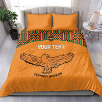 Orange duvet and two pillows with Kente panel border and large bird emblem center