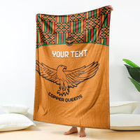 Orange football blanket standing display with Kente patterned top and eagle graphic