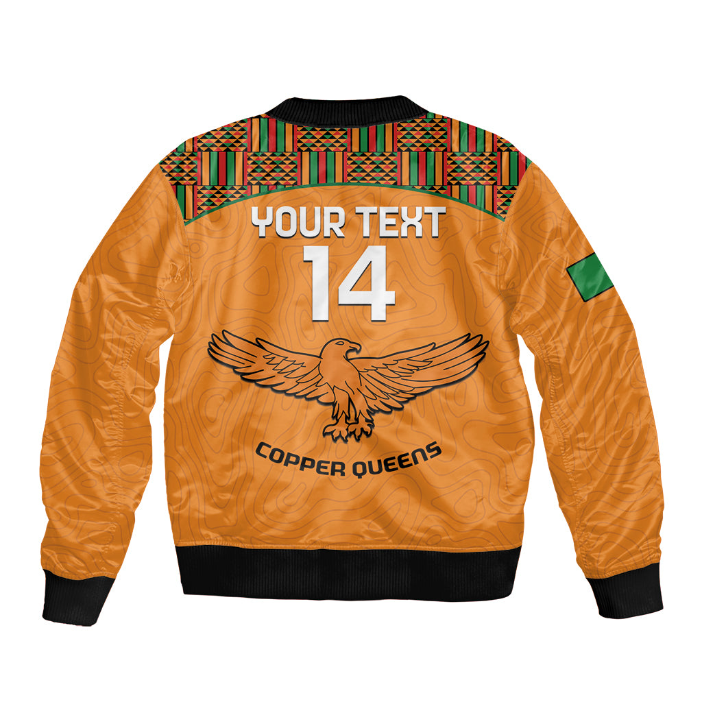 Orange bomber jacket back with YOUR TEXT 14 graphic, kente yoke, black ribbed hem